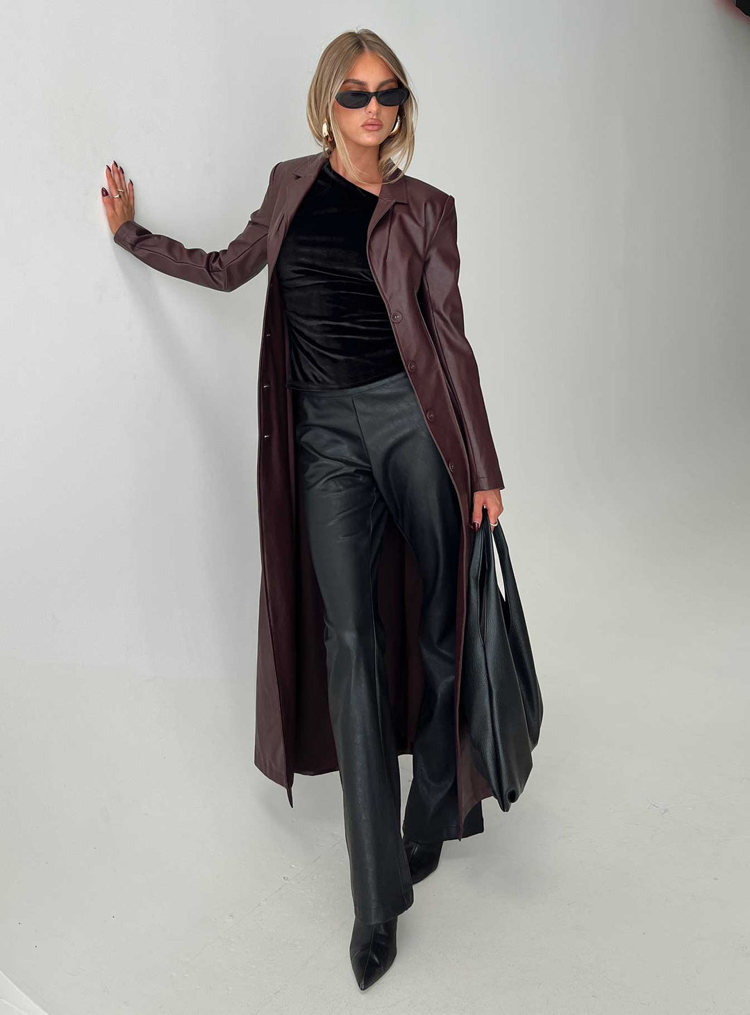 Kara | Women’s longline faux leather trench coat with lapel collar and pleat detail