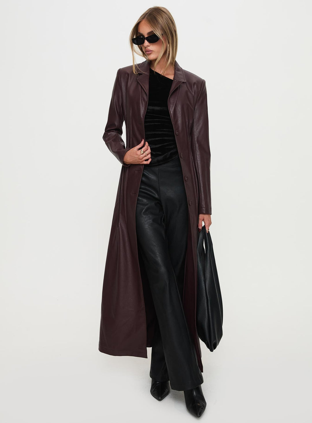 Kara | Women’s longline faux leather trench coat with lapel collar and pleat detail