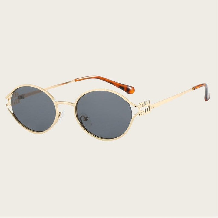 Sumer | Women's oval frame sunglasses with gold frame and brown/black lenses