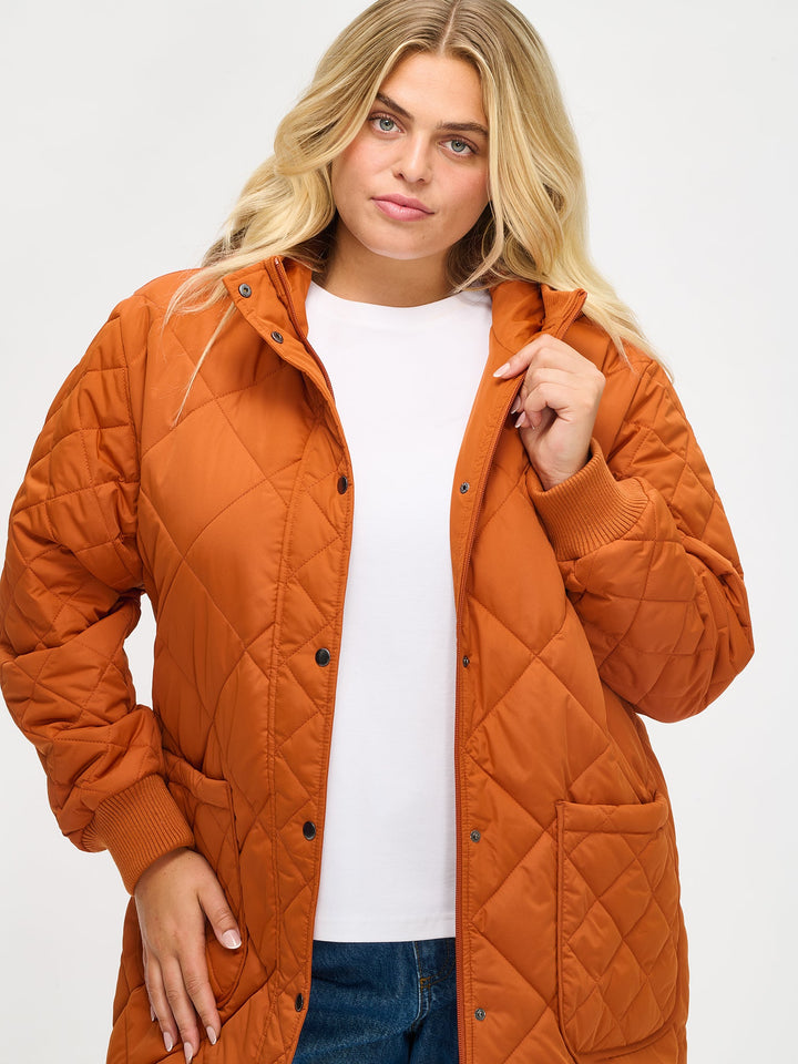 Solana | Women’s long quilted hooded coat with oversized patch pockets