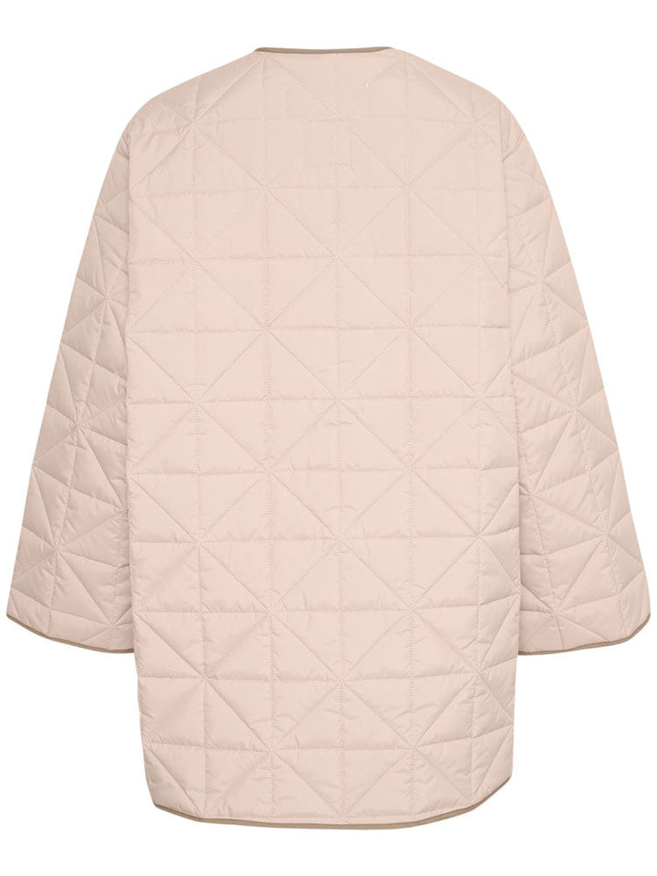 Peyton | Women’s minimalist quilted jacket with side slit details