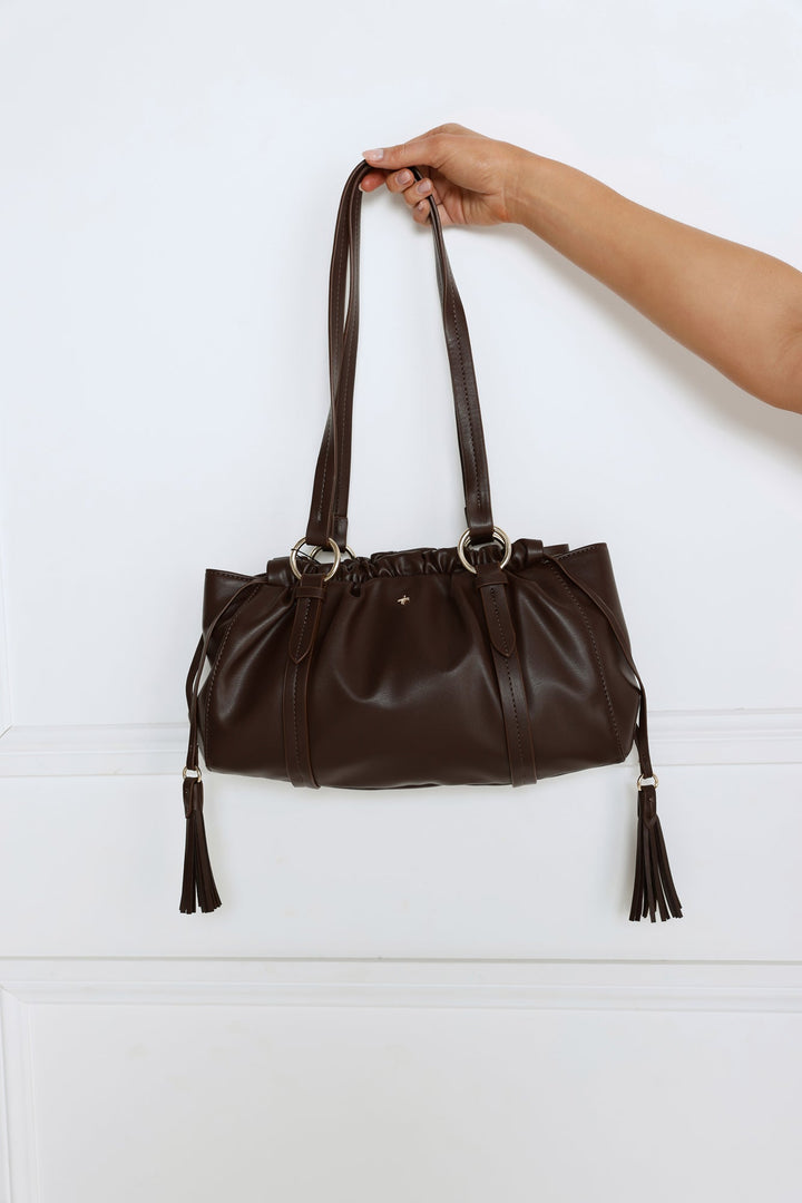 Lorie | Women’s tote bag with tassel detail and ring accents