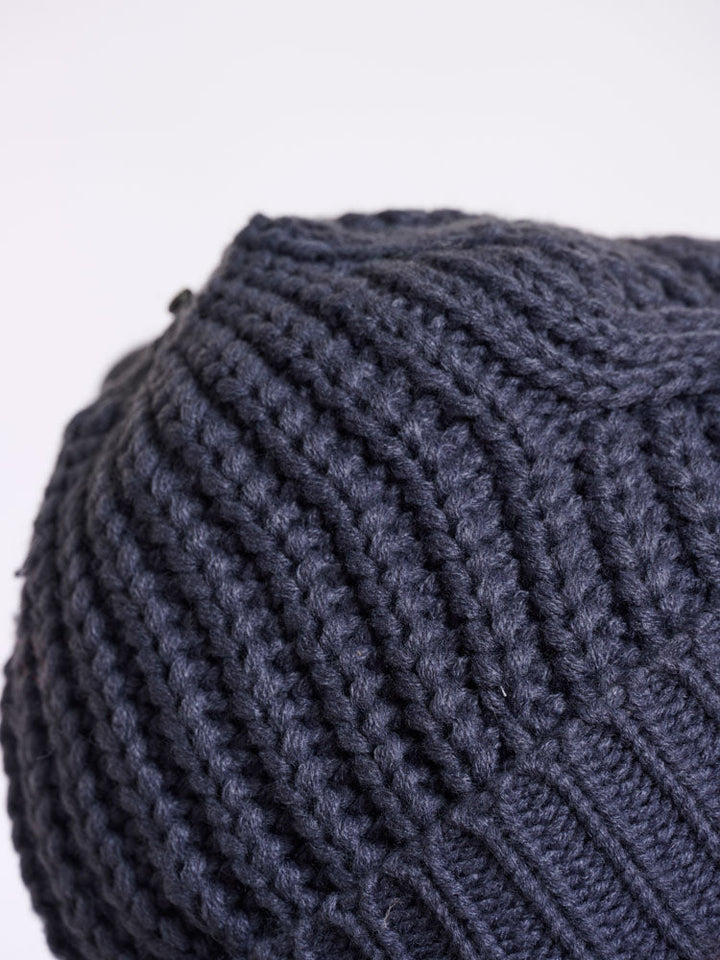 Raya | Women’s cable knit beanie with faux fur pom