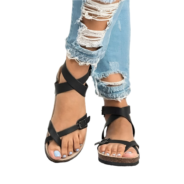 Women’s sandals with adjustable buckle and shaped sole