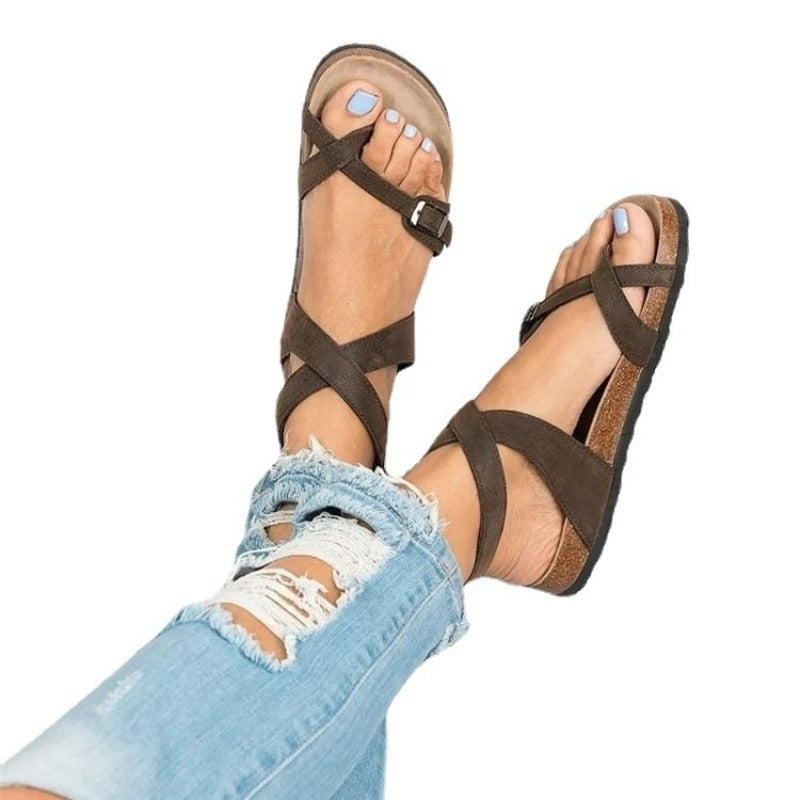 Women’s sandals with adjustable buckle and shaped sole