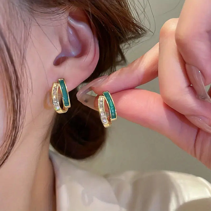 Fella | Women’s gold hoop earrings with green stone and crystal detail